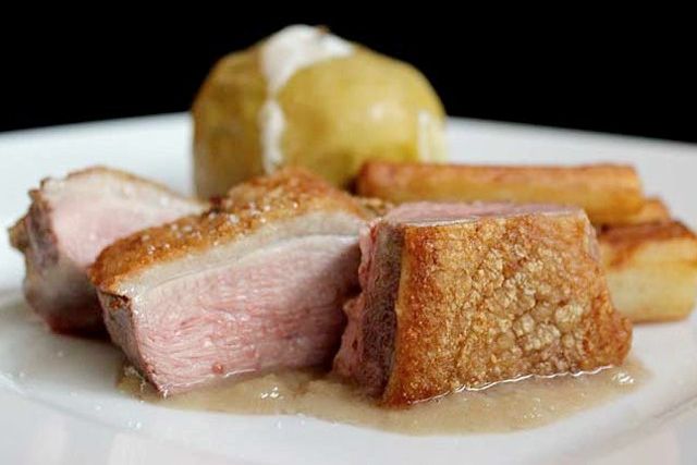 Slow roasted duck breast and leg, served with potato and granny smith apples stewed in duck jus